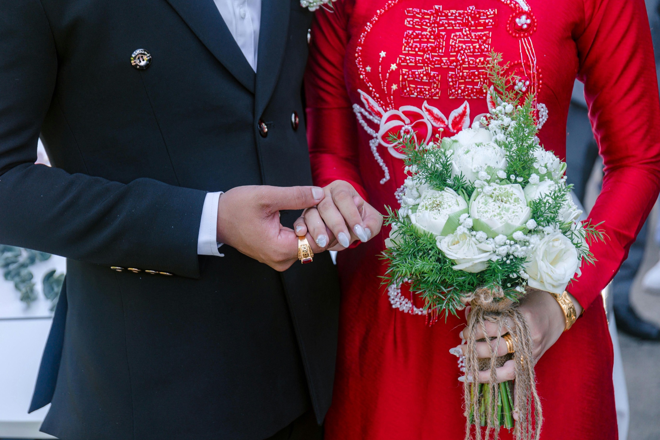 Host approval moment with a wedding ring and bouquet